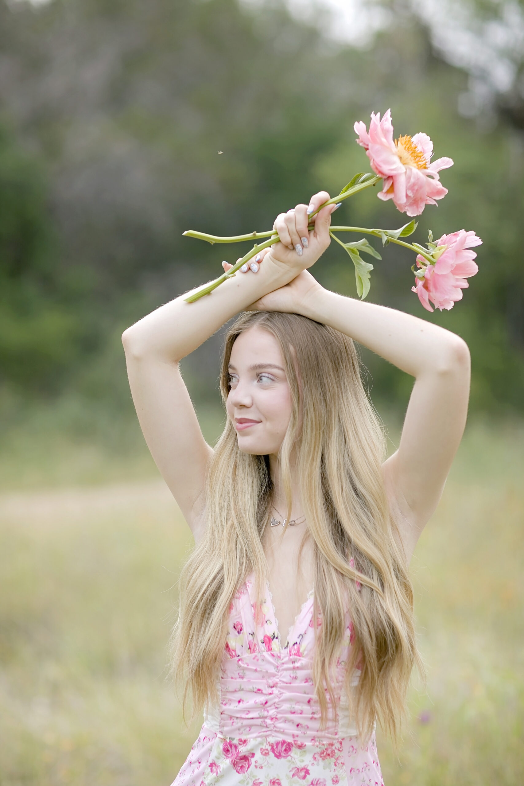 Floral-themed lifestyle portraits of Ellie in San Antonio, Texas, capturing her post-high school achievements and natural beauty.