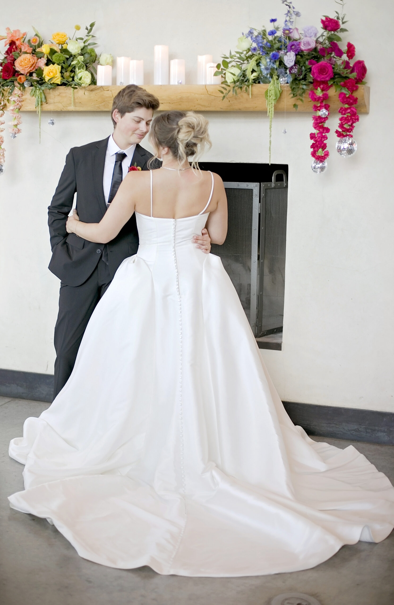 These images showcase a vibrant LGBTQ styled wedding shoot at Deep Eddy Vodka Distillery in Austin, Texas, celebrating inclusivity, love, and creativity. The rainbow-themed details—from florals and tablescapes to stationery and desserts—highlight a joyful and colorful wedding aesthetic. Each photo captures the collaborative work of top Austin vendors, including Bluebonnet Events, Bluebonnet Field Floral, Cojo Moxon, Garnish Bar Company, Reunion Coffee, Sugar Clous Cotton Candy, Gaines Entertainment, Soulful Sax Entertainment, Viva La Glam, Texas Wedding Ministries, and Brides by Elizabeth, bringing the vision of an inclusive and stylish celebration to life.