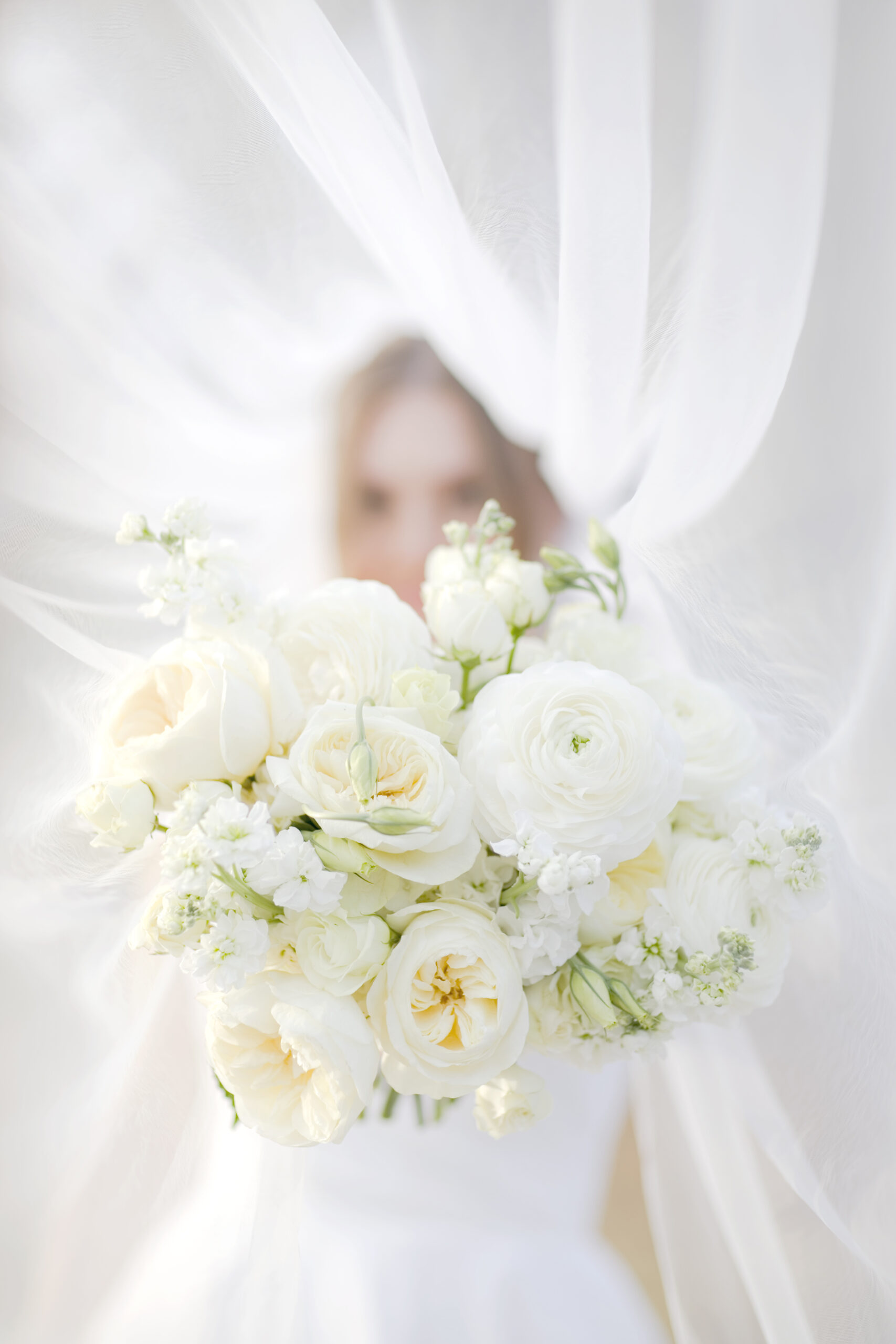 Bridal portraits of Lauren in the greenhouse at Dos Palomas Ranch, capturing intimate moments during a rainy San Antonio bridal session.