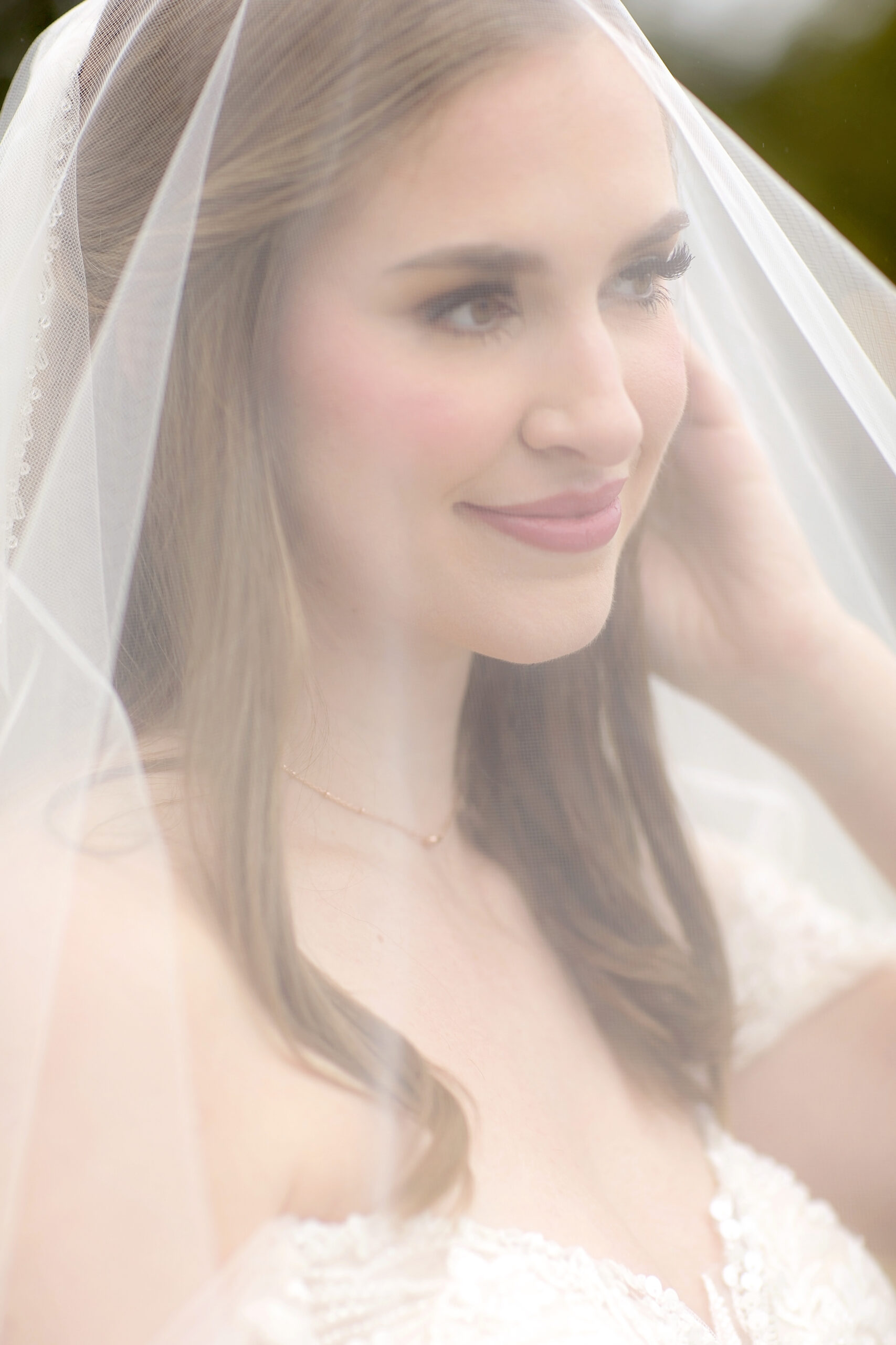 Bride in a flowing wedding gown during a bridal session prior to her wedding day at a Texas Hill Country wedding venue