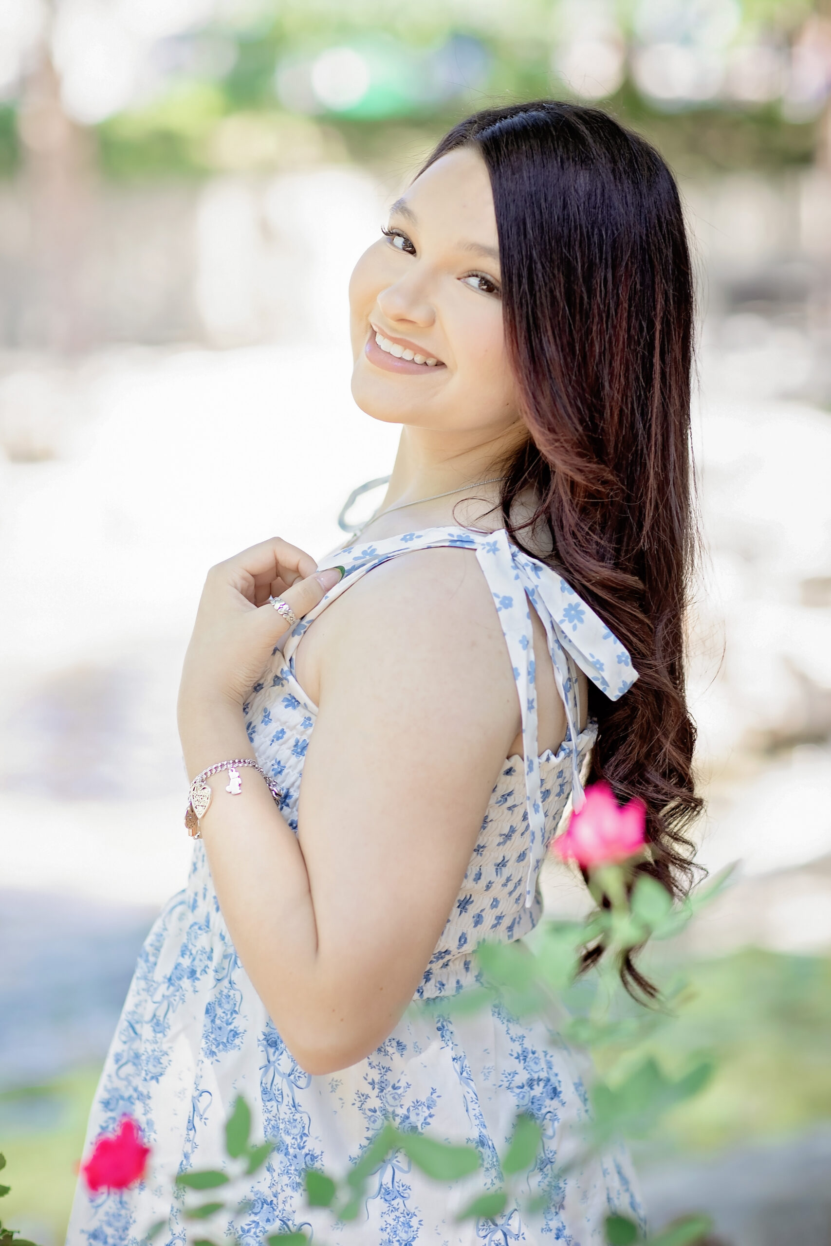 Danika and her friend Noely posing together in graduation photos during their senior sessions at Pearl in San Antonio, Texas.