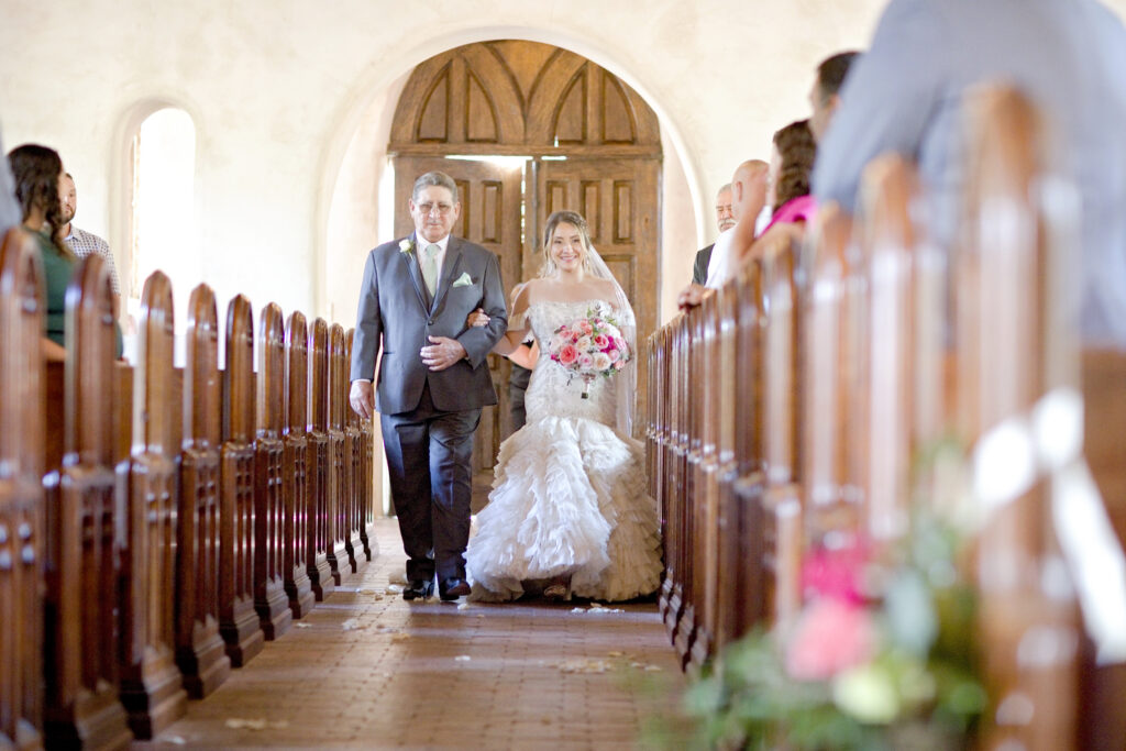 Texas Hill Country bride walking down the wedding aisle