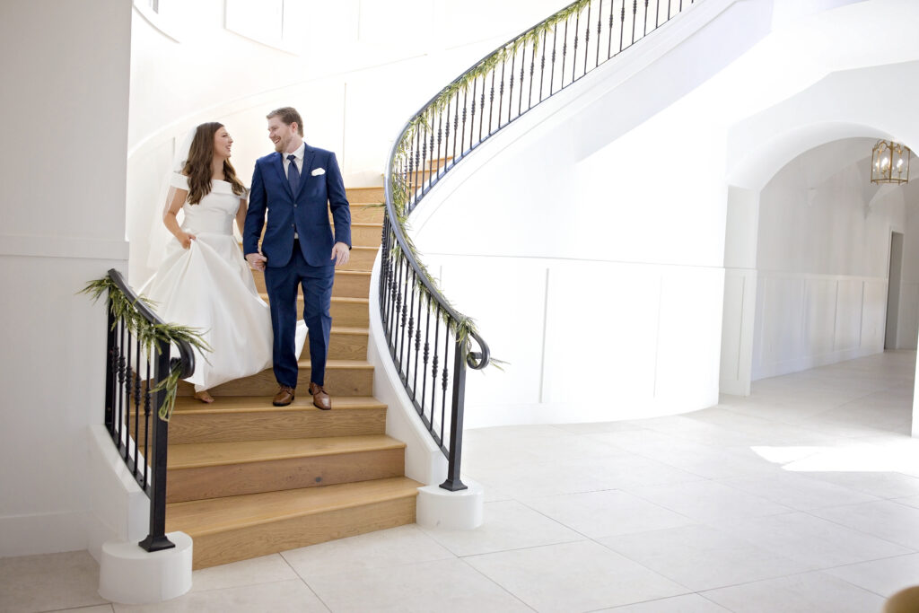 Texas Hill Country wedding couple on a bright white venue staircase