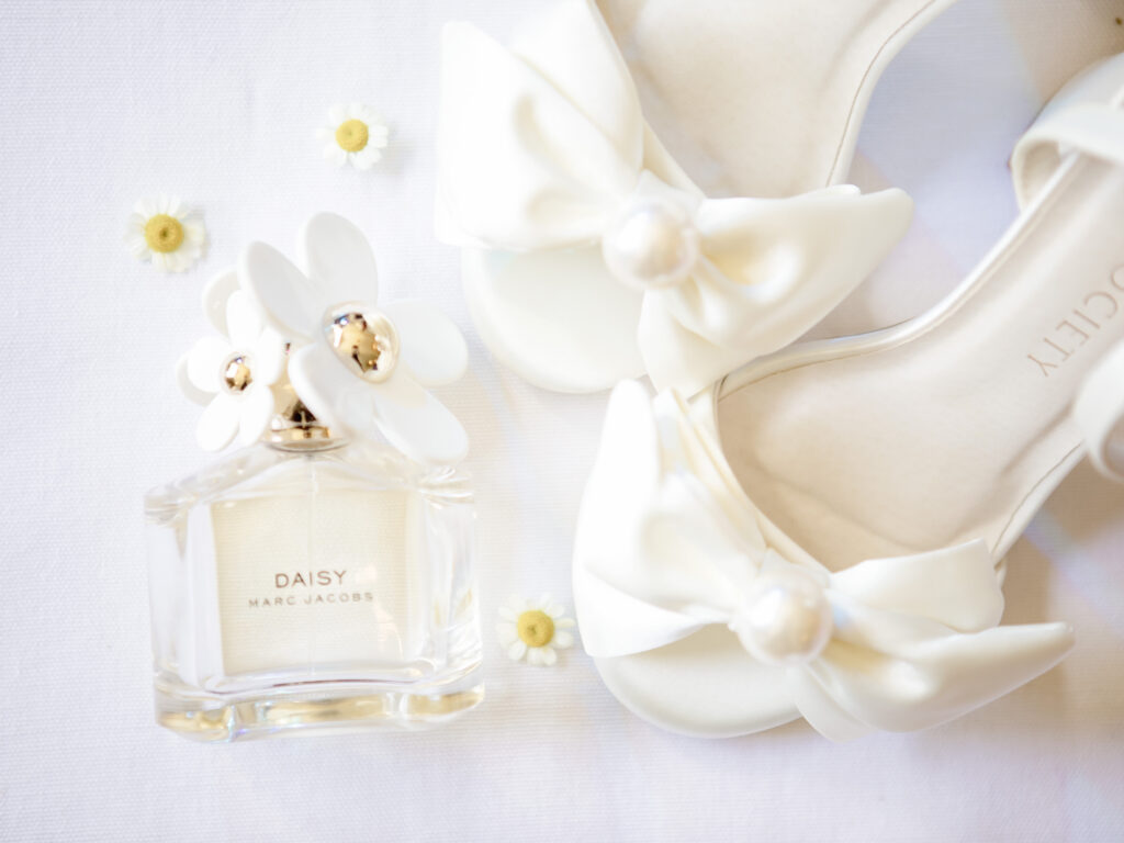 Wedding day bridal details with Marc Jacobs perfume and bridal shoes