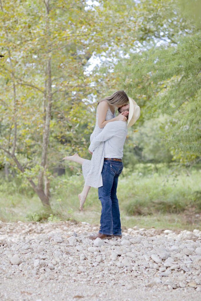 Bride and groom laughing during outdoor wedding portraits