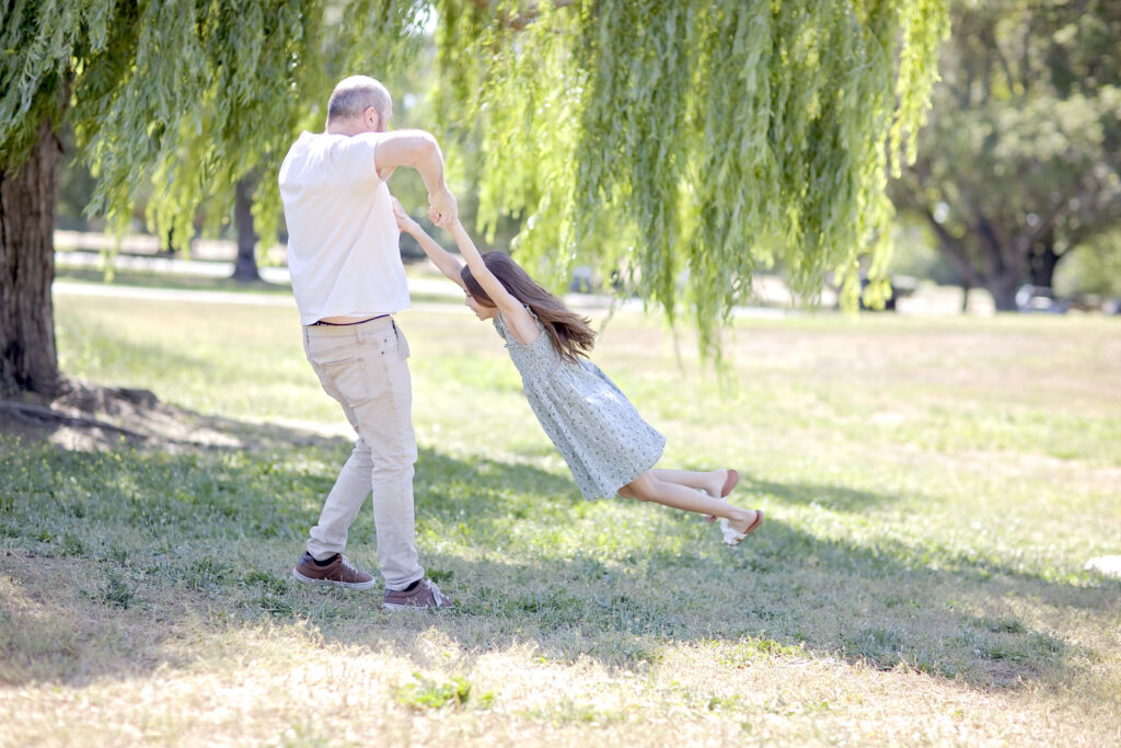 Father and daughter playing during a San Antonio family portrait session