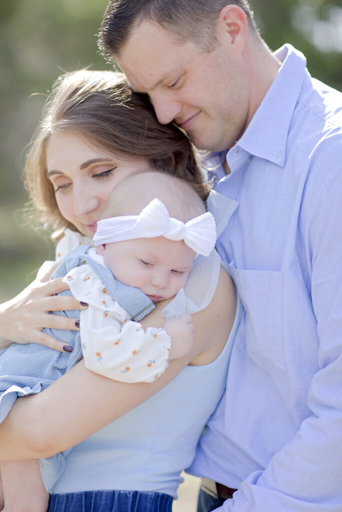 Parents holding their baby during a San Antonio family photography session