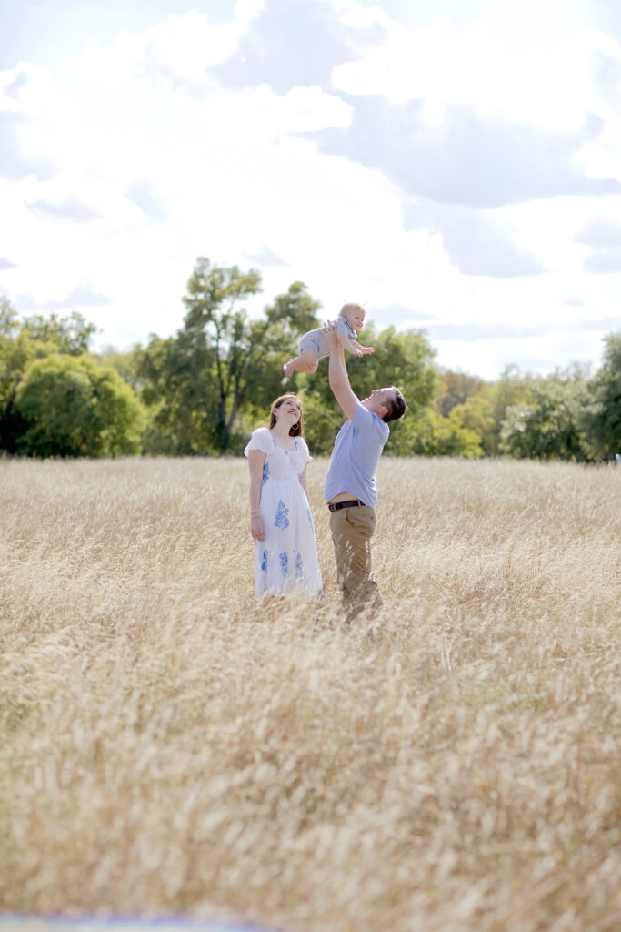 Family enjoying an outdoor photography session in a Texas field
